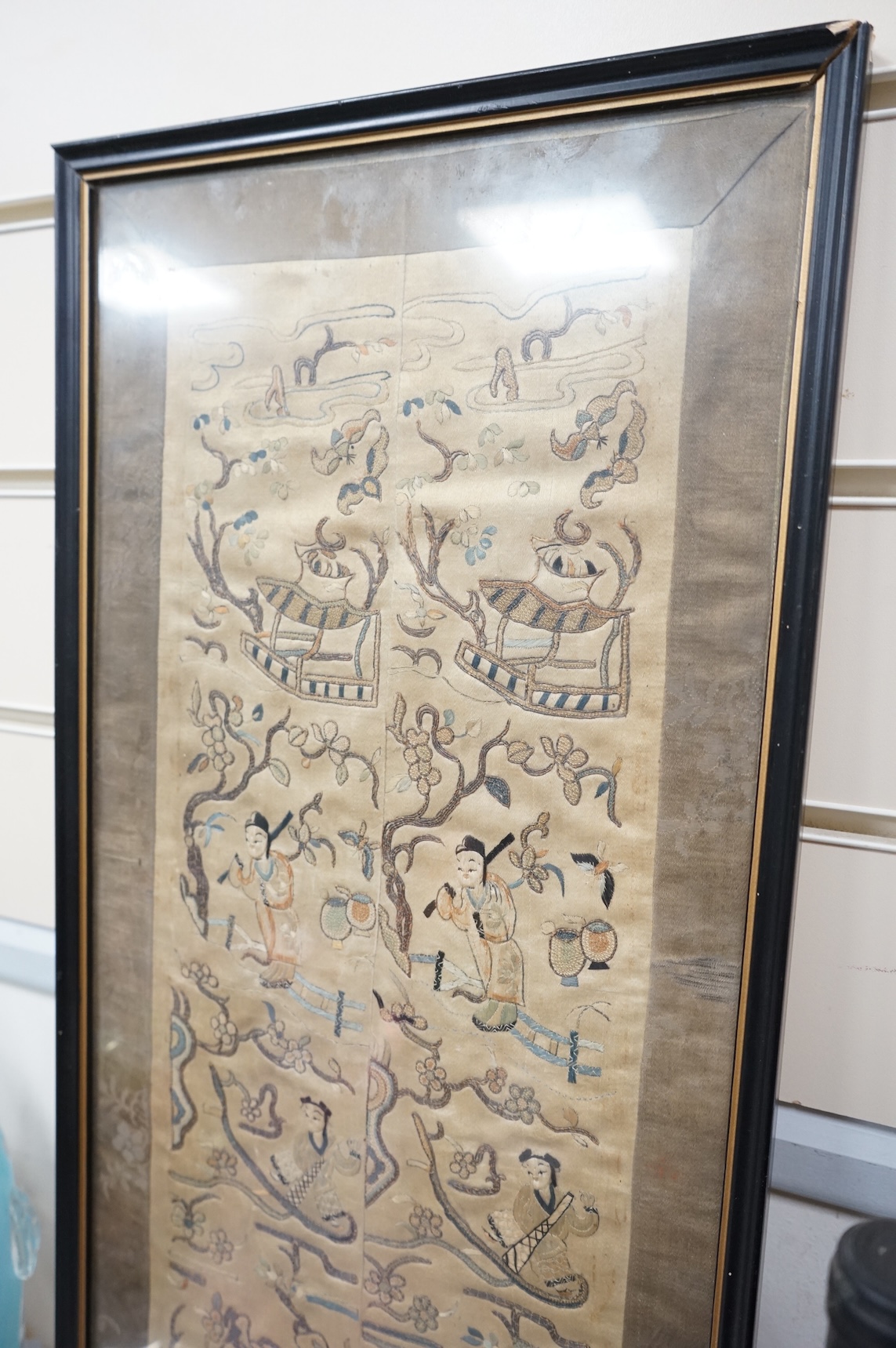 A Chinese silk embroidered sleeve panel, 48x18cm